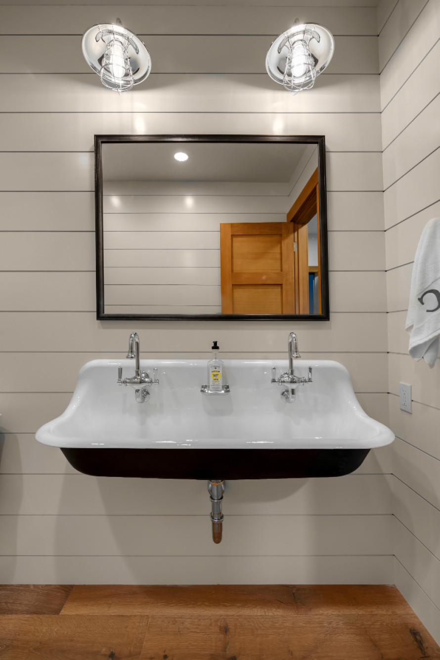 large-porcelin-sink-dual-faucets-shiplap-walls