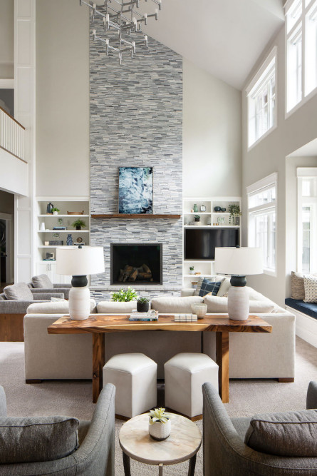 living-room-interior-design-stone-fireplace-high-ceiling