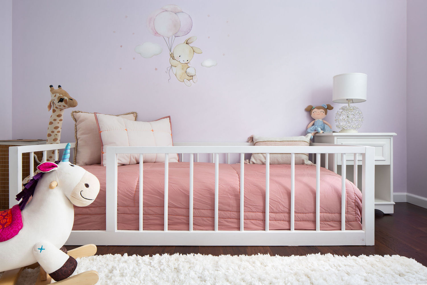 girls-bedroom-bed-rail-purple-walls