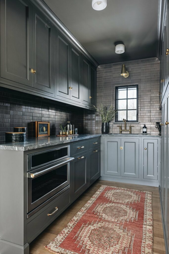 butler's pantry with oven and sink, antique rug and grey cabinets