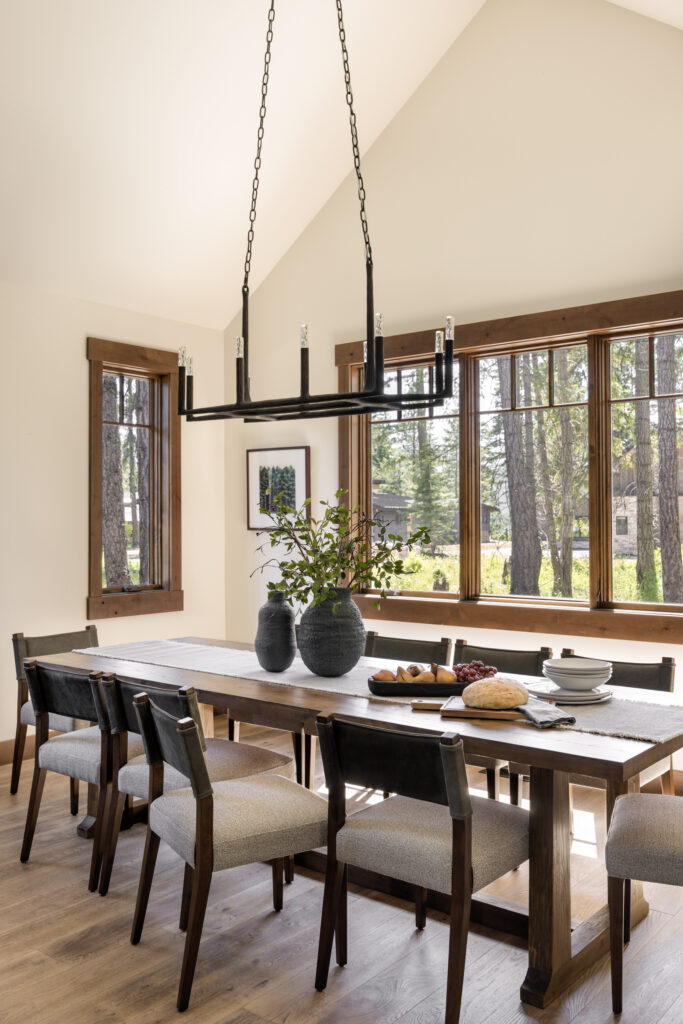 Dining room in Suncadia vacation house by Michelle yorke Interior Design. Modern Farmhouse furnishings with Mountain house inspired architecture and millwork. Photograph by Miranda Estes Photography