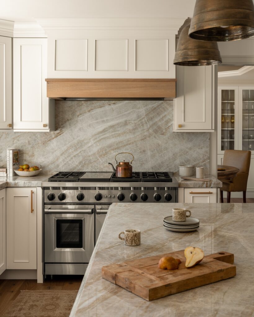 cutting board with cut pear on kitchen island